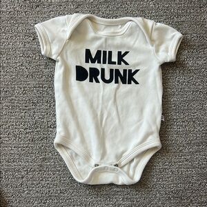 Cream Baby Onesie with Black Text